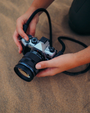 OM SYSTEM OM-5 II silver + 14-150mm II + Peter Hadley BLS-5 battery